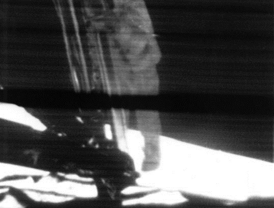 A mounted slowscan TV camera shows Armstrong as he climbs down the ladder to surface.jpg